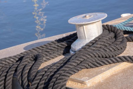 Boots and mooring on a pontoon  background, close up