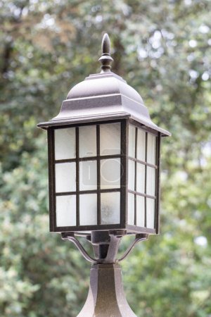 Old lantern on a garden lamp post, retro style and steampunk
