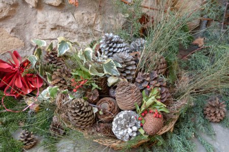 Christmas decoration with pine cones on background