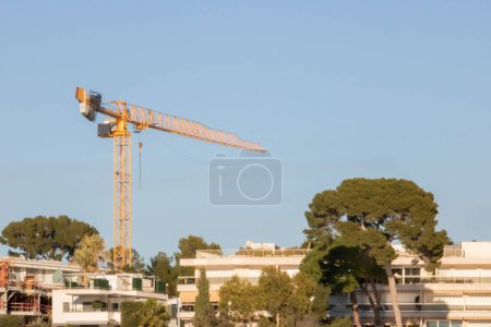Construction crane seen through the bearing of a lifting crane of the shipyard Juan les Pins France