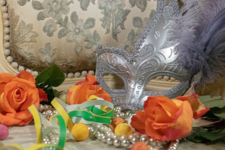 Flowers, carnival mask and beautiful roses