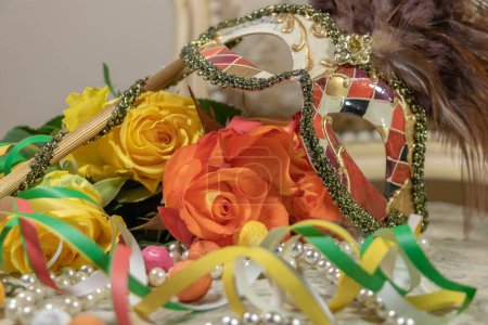 Flowers, carnival mask and beautiful roses