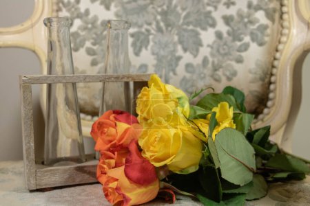 Preparation of a bouquet of roses in a shabby chic universe with noble and rustic materials
