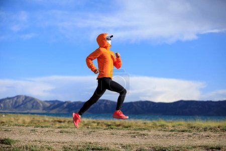 Photo for Woman trail runner cross country running outdoors - Royalty Free Image