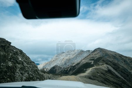 Photo for Driving car on high altitude mountain trail, China - Royalty Free Image