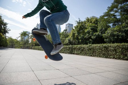 Photo for Skateboarder skateboarding in modern city - Royalty Free Image