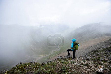 Photo for Successful woman hiker hiking at mountain top in tibet - Royalty Free Image