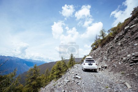 Photo for Driving off road car in high altitude mountains in Sichuan province, China - Royalty Free Image