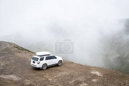 Photo for Off road car on top of high altitude mountain trail, China - Royalty Free Image