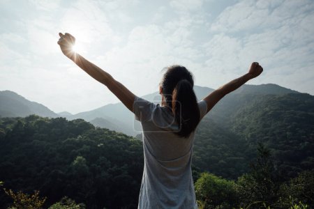 Photo for Cheering happy woman enjoying the view on morning mountain valley - Royalty Free Image
