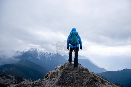 Photo for Successful woman hiker hiking at mountain top in tibet - Royalty Free Image