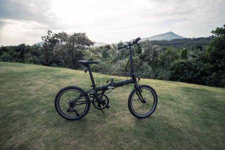 Photo for Folding bike on tropical mountain top - Royalty Free Image