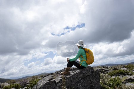 Photo for Hiking woman on high altitude mountains - Royalty Free Image