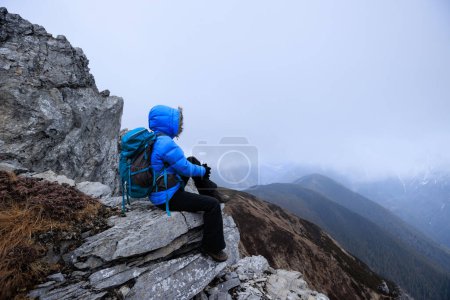 Photo for Woman hiker hiking at mountain top in tibet - Royalty Free Image