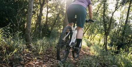 Photo for Mountain biking on spring forest trail - Royalty Free Image