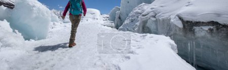 Photo for Woman hiker hiking in winter huge glacier mountain,China - Royalty Free Image