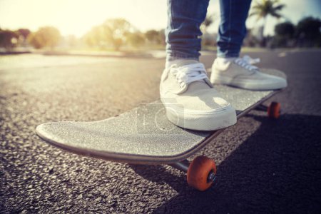 Photo for Skateboard outdoors in sunrise citys - Royalty Free Image