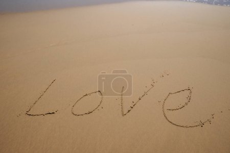 Foto de Palabra de amor dibujada en la playa - Imagen libre de derechos
