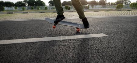 Photo for Skateboard on asphalt road in city - Royalty Free Image