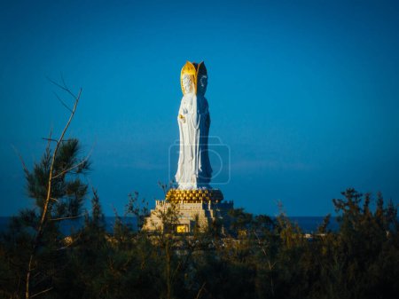 Guanyin statue at seaside in nanshan temple, hainan island , China. Words mean mercy and blessing.