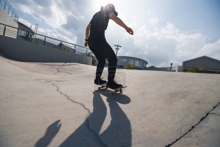 Photo for Skateboarder skateboarding at skatepark in city - Royalty Free Image