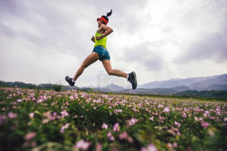 Woman runner running in spring 