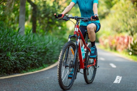 Photo for Riding a bike on tropical park trail - Royalty Free Image