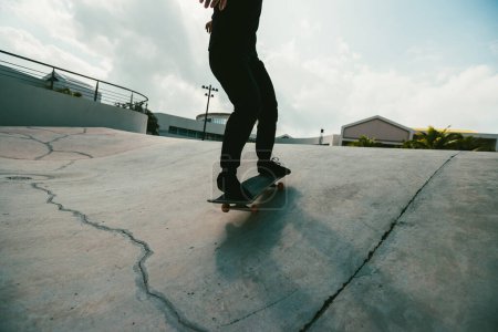 Photo for Skateboarder skateboarding at skatepark in city - Royalty Free Image