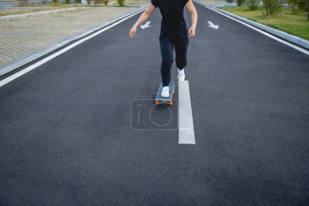 Photo for Skateboarder skateboarding outdoors in city - Royalty Free Image