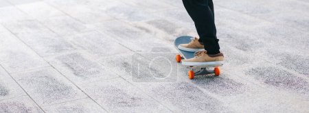 Photo for Skateboarder skateboarding outdoors in city - Royalty Free Image