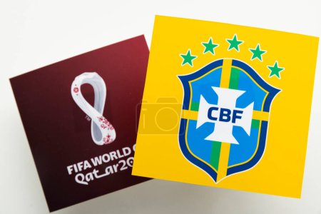 Photo for LONDON, UK - December 2022: Brazil national football team logo logo with Qatar world cup logo. - Royalty Free Image