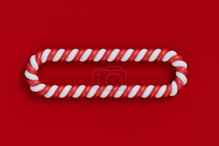 Foto de Navidad caramelo bastón rojo y blanco marco de rayas. Dulces de rayas festivas. Renderizado 3D. - Imagen libre de derechos