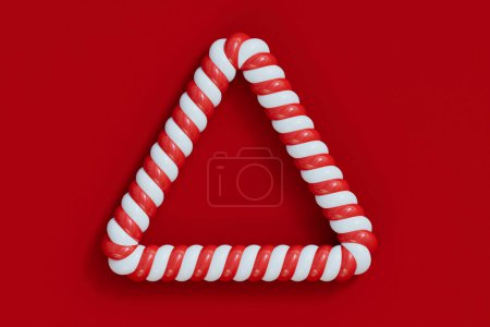 Téléchargez les photos : Canne à bonbons de Noël cadre rayé rouge et blanc. Bonbons rayés festifs. Rendu 3D. - en image libre de droit