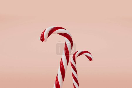 Photo for Christmas candy cane red and white festive sweet on a pink background. 3D Rendering. - Royalty Free Image