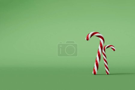 Photo for Christmas candy cane red and white festive sweet on a green background. 3D Rendering - Royalty Free Image