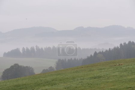 Photo for Foggy autumn landscape and the hills- fog and autumn, Austria - Royalty Free Image