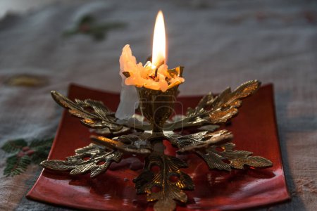 Photo for Candle burning and melting in the candle holder - romantic - Royalty Free Image