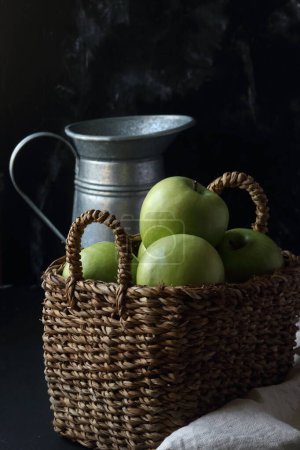 Photo for Green apples in a basket on a black background - Royalty Free Image