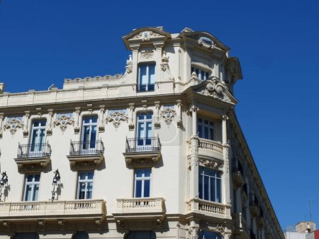corner of vintage rich building in baroque architectural style downtown madrid, spain.