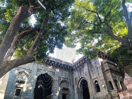 Photo for Stock photo of Tuljabhavani Mata Mandir or temple inside view, temple build in the 12 th century using black stones. big green trees around temple premises. Picture captured under natural light . - Royalty Free Image