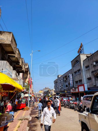 Photo for Tuljapur,India- October 28th 2022; Outside view of Goddess Tulaja bhavani mata temple, crowd of devotees for visit in festival season. commercial buildings shop, hotels , street vendor around temple. - Royalty Free Image