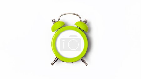 Photo for Beautiful lime green metal alarm clock isolated on white background. Concept of time. Clock face isolated white as a mock up - Royalty Free Image
