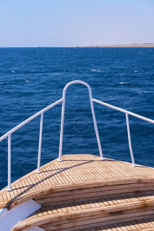 Bow of a Wooden Boat Sailing on the Blue Sea.