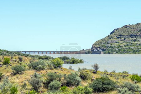 Photo for The over full Vanderkloof Dam seen from Vanderkloof town. It is the second largest dam in South Africa. It has the tallest dam wall in South Africa - Royalty Free Image