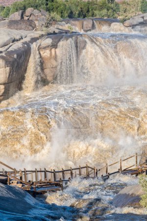 Photo for Flooded boardwalk at the main Augrabies waterfall in the Orange River. - Royalty Free Image