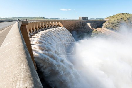 Photo for Tourists on the Gariep Dam wall, watching it overflowing - Royalty Free Image