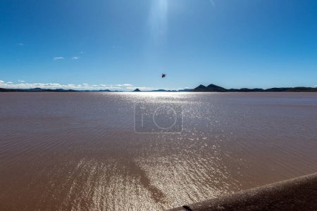 Photo for Reflections on the Gariep Dam in the Orange River. A bird is visible - Royalty Free Image