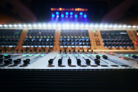 Photo for Selective focus on sliders of professional audio mixing console against colorful spotlights - Royalty Free Image