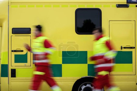 Photo for Team two paramedic running to ambulance car of emergency medical service. Themes rescue, urgency and health care. - Royalty Free Image