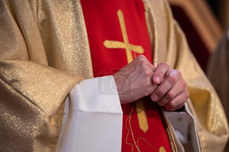 Photo for Hands of a Catholic priest in a cassock - Royalty Free Image
